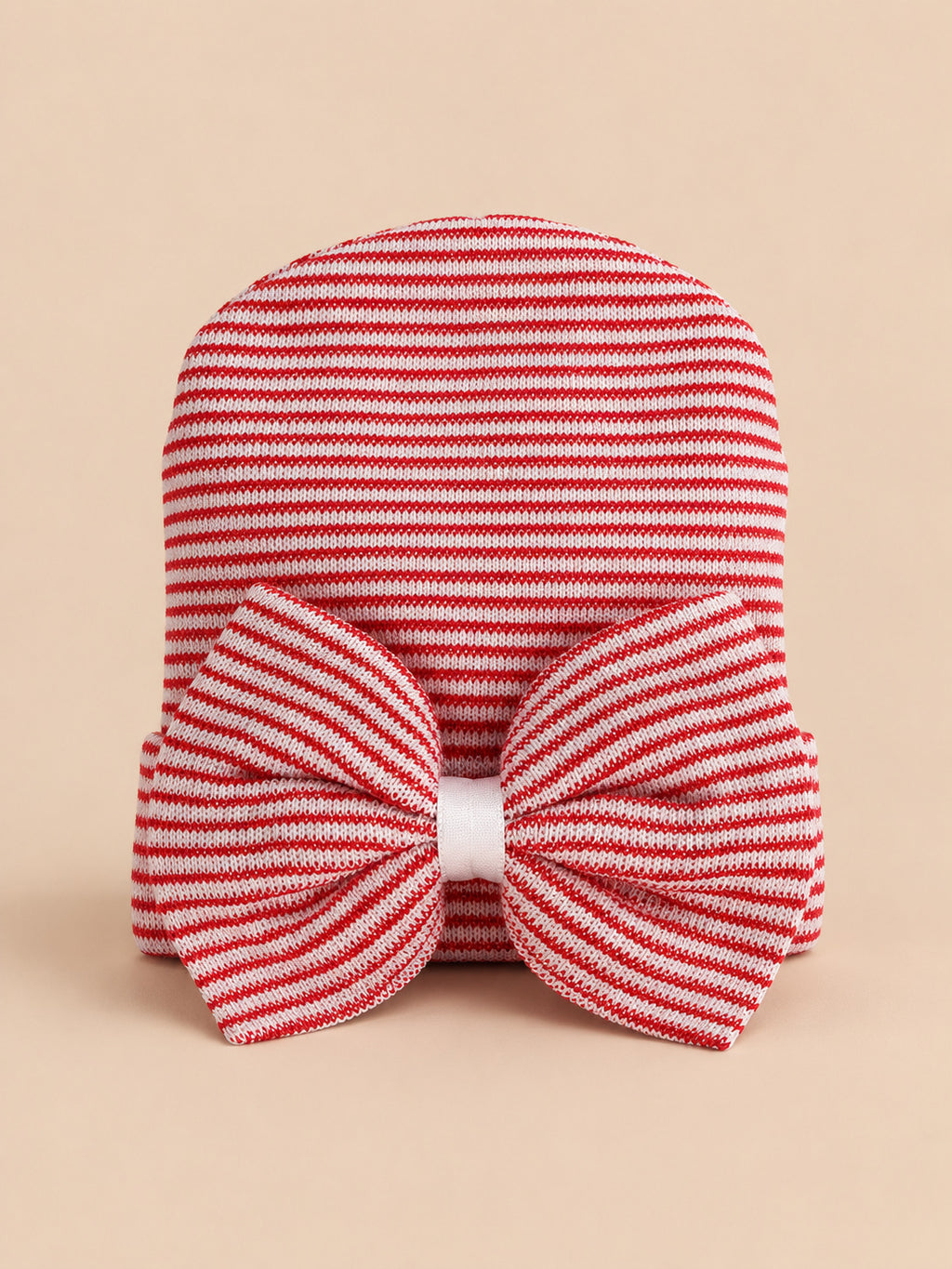 Gorro de recién nacida de algodón a rayas con lazo grande, colores rojo y blanco, vista frontal