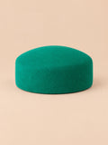 Boina elegante de mujer de lana afieltrada para ceremonia, color verde, parte superior plana, vista frontal