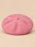 Boina francesa retro de mujer de pura lana, color rosa, vista frontal en la fotografía del producto