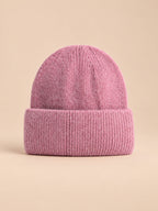 Bonnet femme en fourrure de lapin et coton épais, modèle 2, vue de face sur fond pêche sable