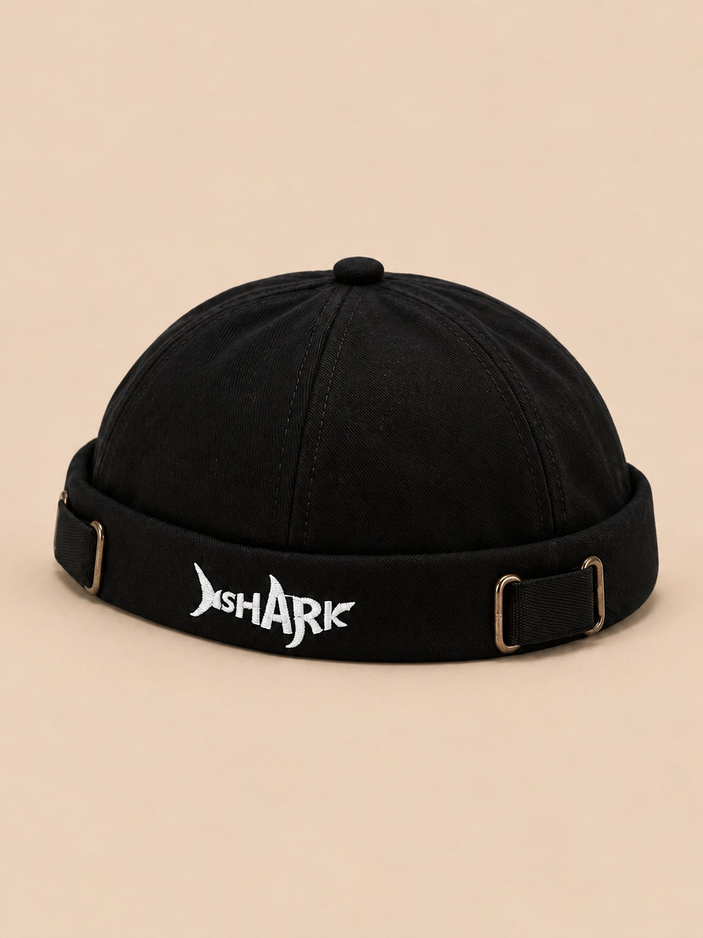 Bonnet docker Bocca noir en coton, broderie SHARK et boucles réglables, vue de trois quarts.