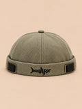Bonnet docker Bocca vert en coton, broderie SHARK et boucles réglables, vue de face.