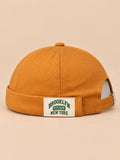 Bonnet docker BROOKLYN1631 jaune, vue de face, étiquette vintage.