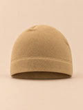 Bonnet polaire coupe-vent pour vélo kaki sable, vue de face sur fond beige