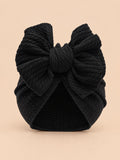 Turbante negro para recién nacida con nudo, modelo a juego para madre e hija, fotografiado de frente