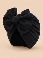 Gorro turbante anudado de bebé niña a juego con mamá, color negro, vista de tres cuartos