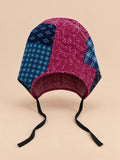 Turbante de mujer de tela patchwork con nudo bicolor en forma de flor, modelo 2, fotografiado de frente