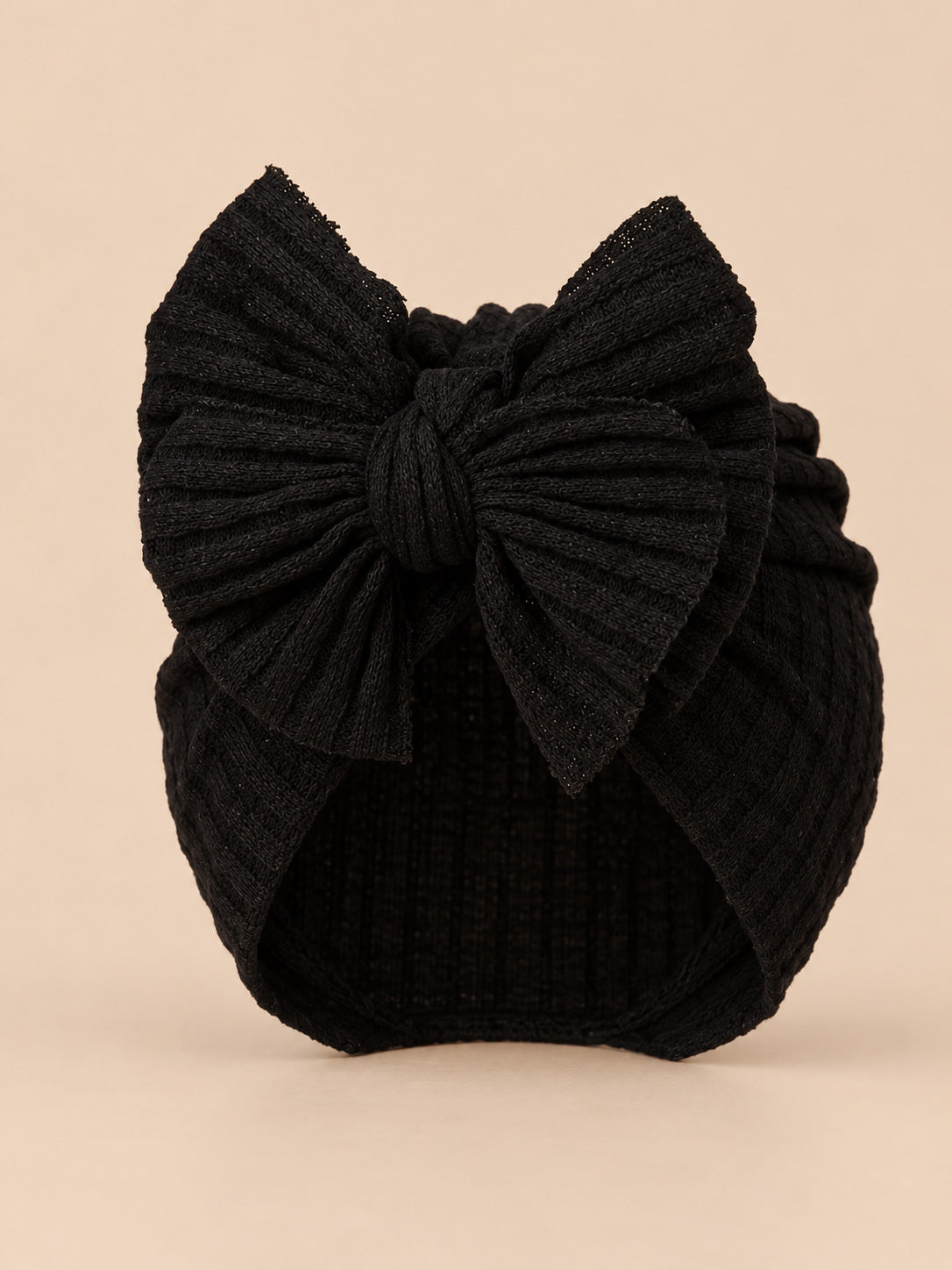 Bonnet turban bébé fille en coton tricoté noir, nœud, vue de face